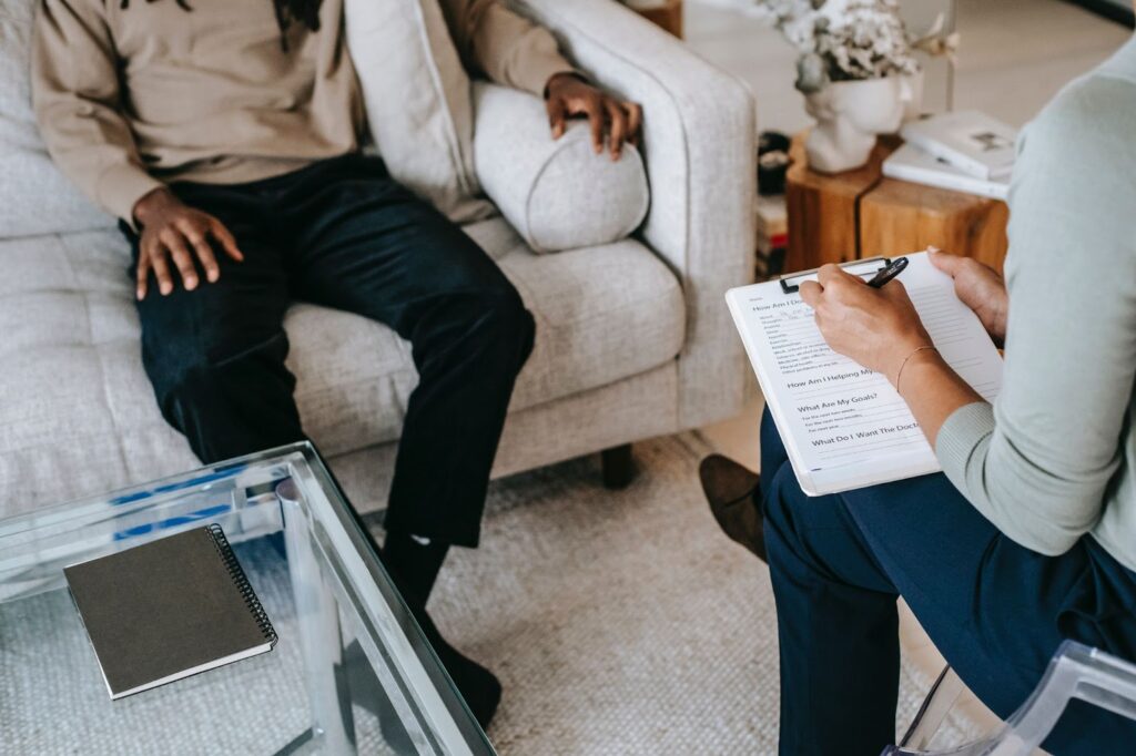 A therapist and their patient during a consultation.